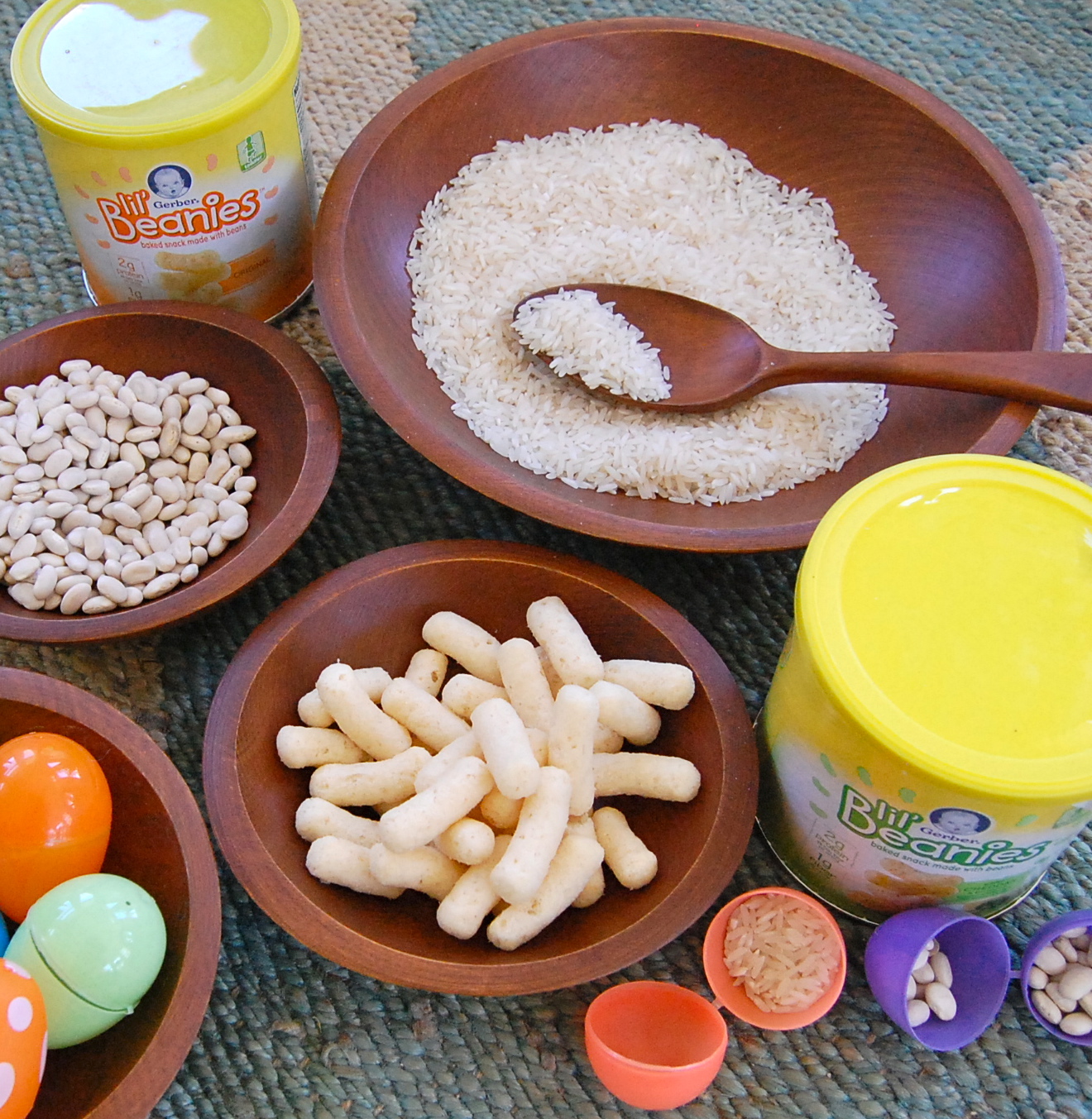 Repurpose your plastic Easter Eggs for toddler sensory play by making egg shakers! Let toddlers fill the eggs with rice, beans or both and then shake, shake, shake! #gerberlilbeanies #sensoryplay #toddlerplay #healthytoddlersnacks juliannegray.com